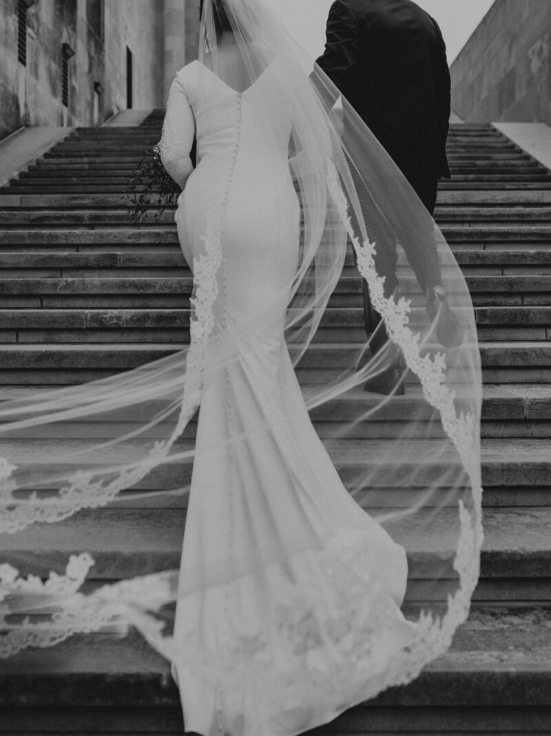 Bride gracefully stepping down stairs