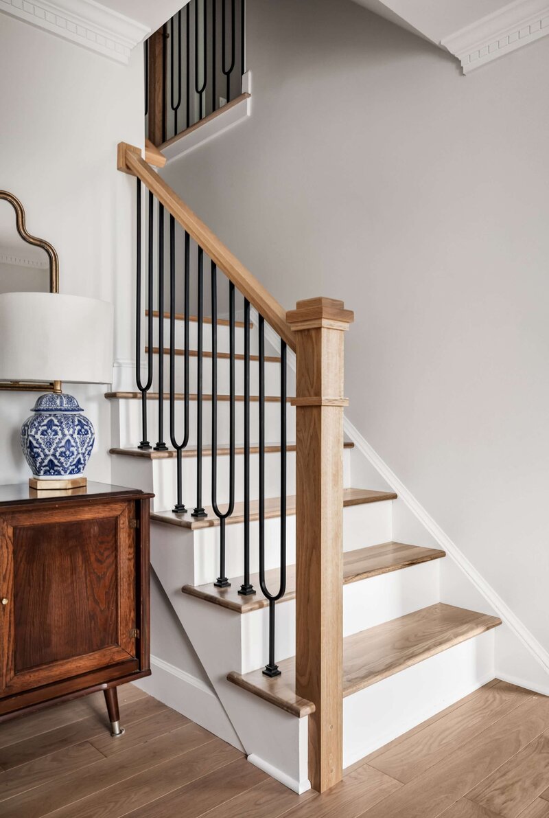 Entry remodel in Hillsboro, VA with custom staircase and light oak floors.