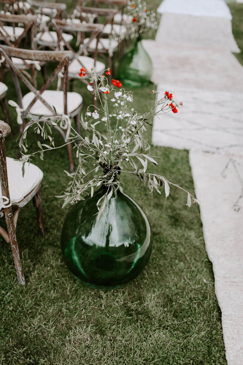 GREEN VASE OF FLOWERS MARQUEE WEDDING