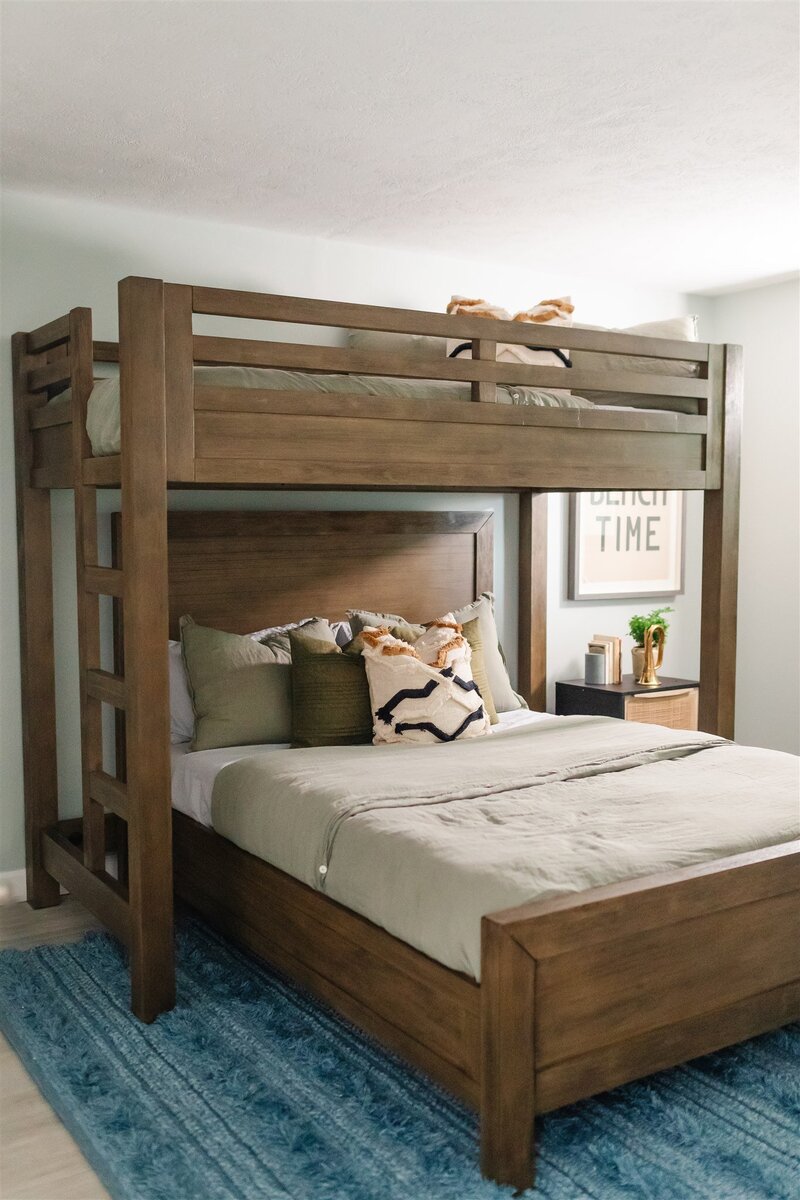 guest room with oak bunk beds, linen duvet cover and throw pillows