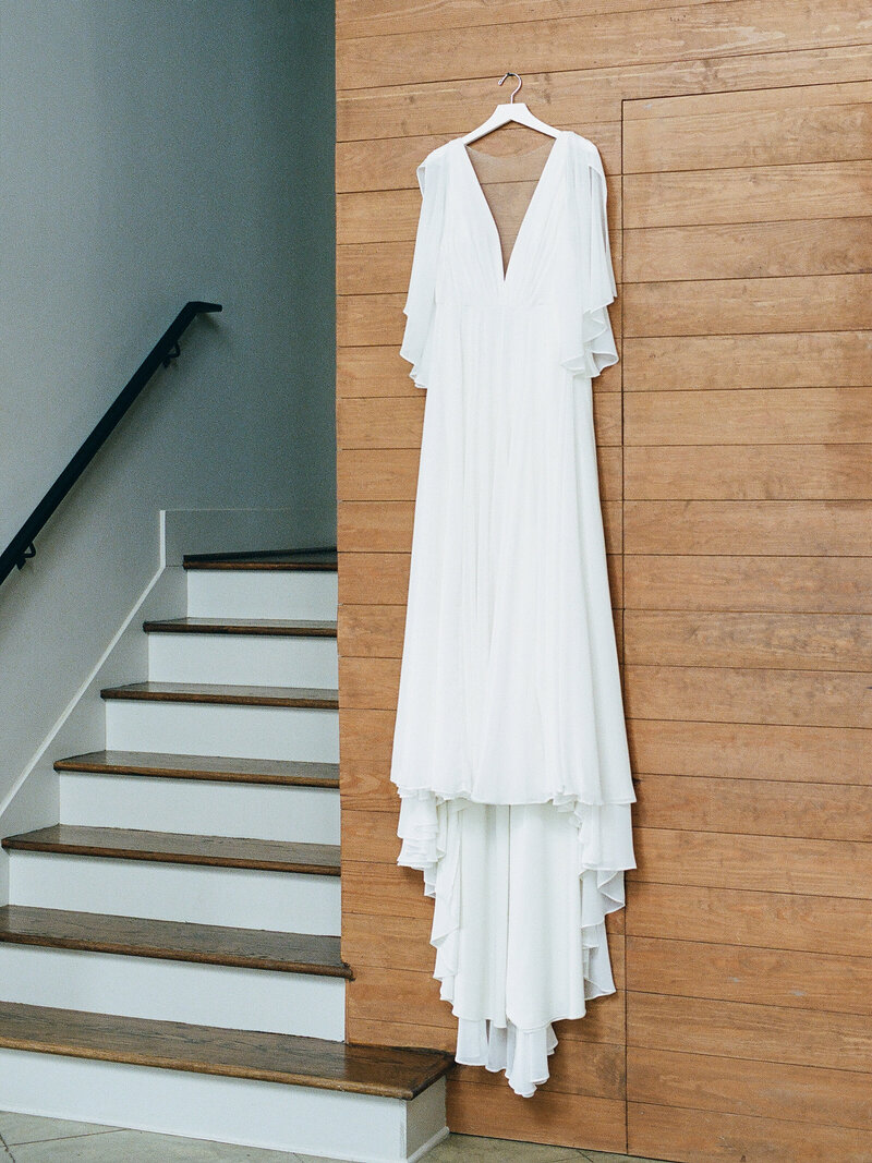 Brides Dress Hanging on Wall