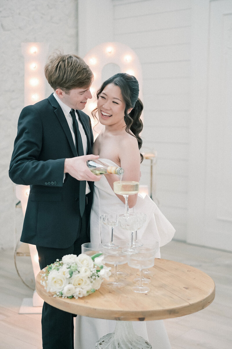 Dallas-Fort Worth Wedding Photographer | DFW Photographer Rae De Lain Weddings Light and Airy | Bride and groom cake slicing at The Farm at Ruth's Nest