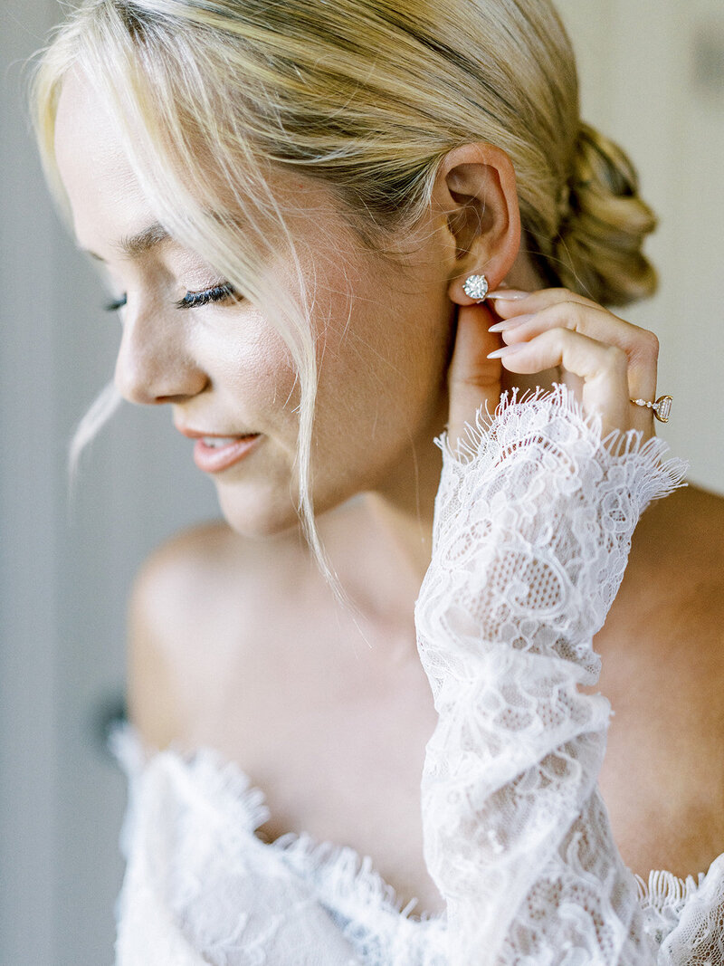 Bride Touching Earrings. Bride details in San Luis Obispo.