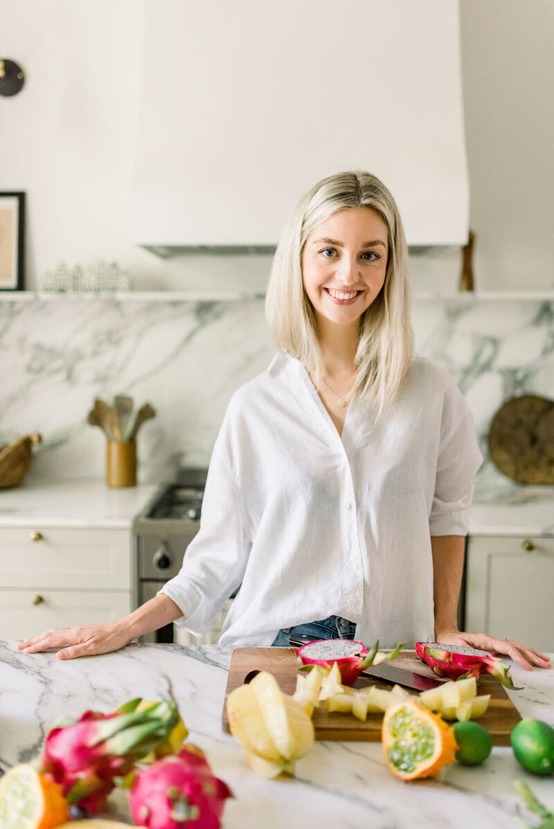 Fertility dietitian Amara Lindenmayer smiling in kitchen