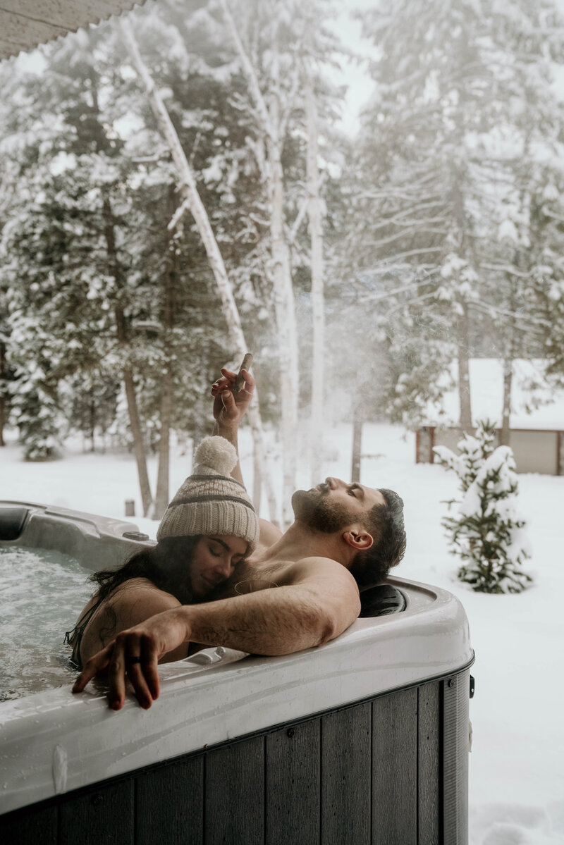 hot tub intimate couple glacier national park snow covered mountains