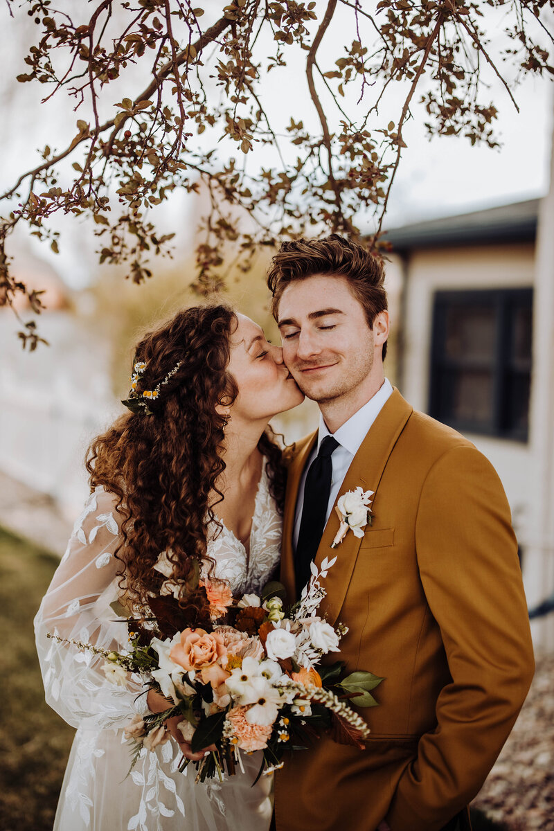 bride-kissing-grooms-cheek