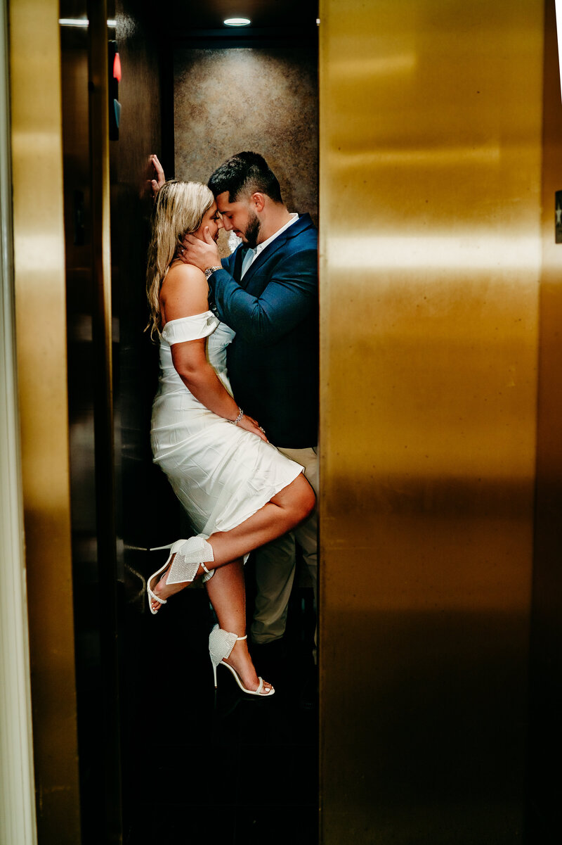 romantic elopement pose in coffee shop in downtown Lafayette, Louisiana