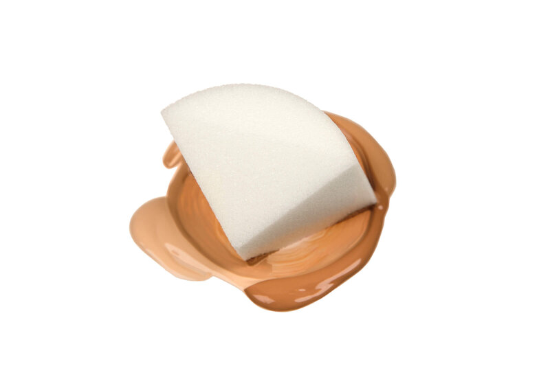 Makeup sponge on top of foundation taken by Sara Vaz.