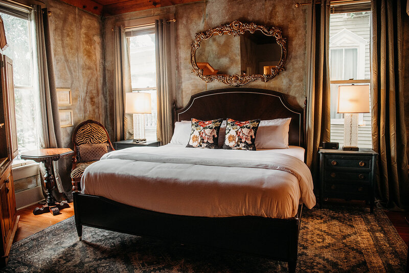King-size bed, crisp white linens anchor this restful room