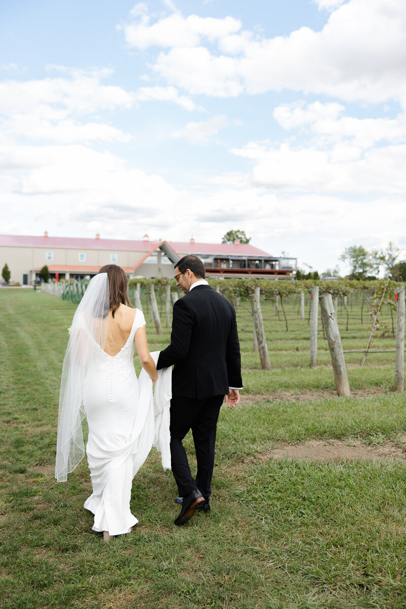 bride and groom walking away