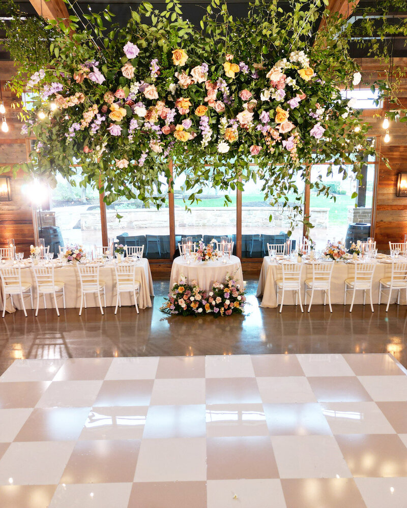 Reception decor in Canyonwood Ridge hall with romantic lighting and Hill Country details