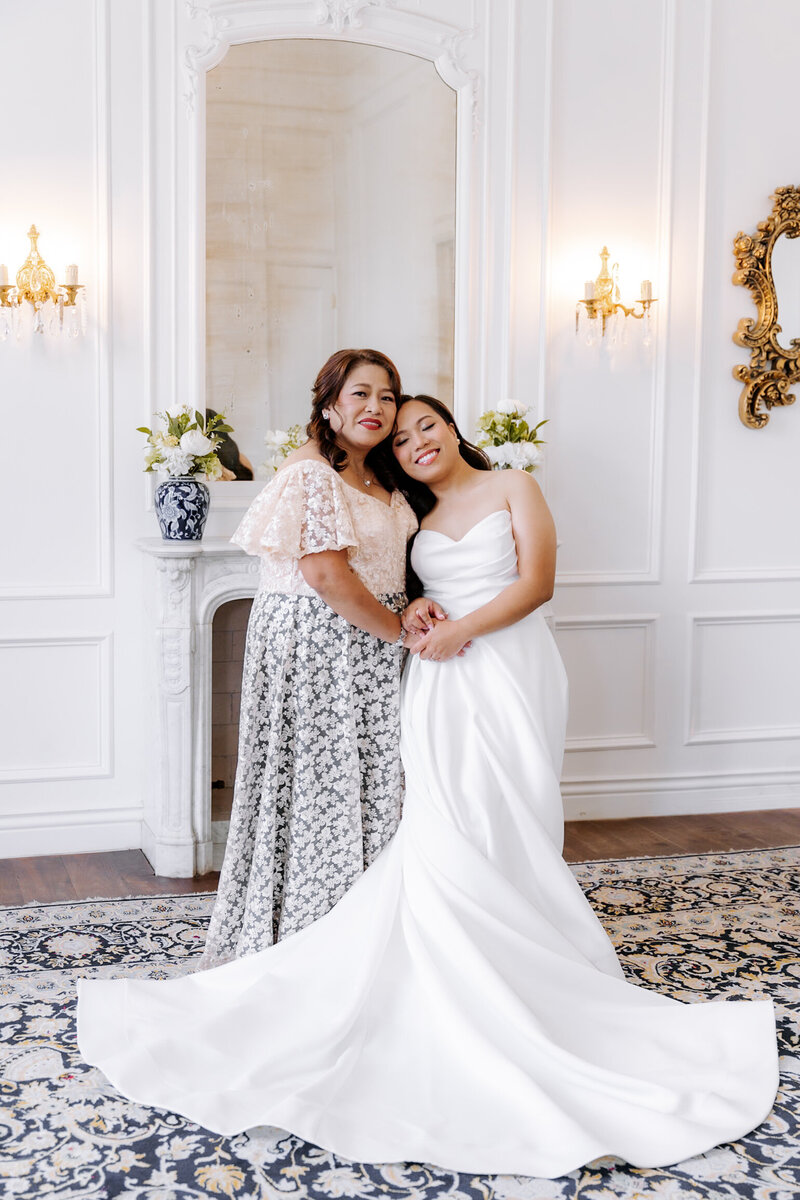 Bride getting ready with her mom before the ceremony — captured by Houston wedding photographers Julie & Daniel