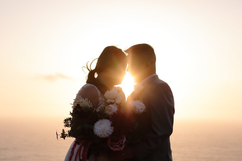 A bride and groom elope on Maui during sunset