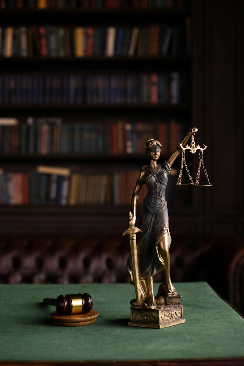 Small statue of Lady Justice in lawyers office