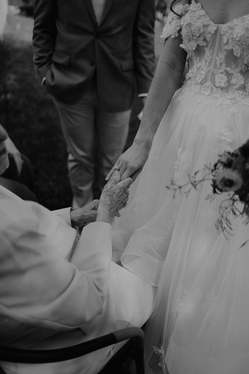A photographer taking pictures of a wedding couple.