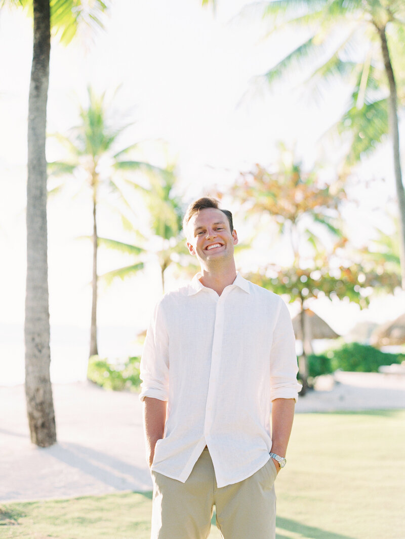 The man on honeymoon portrait under palms