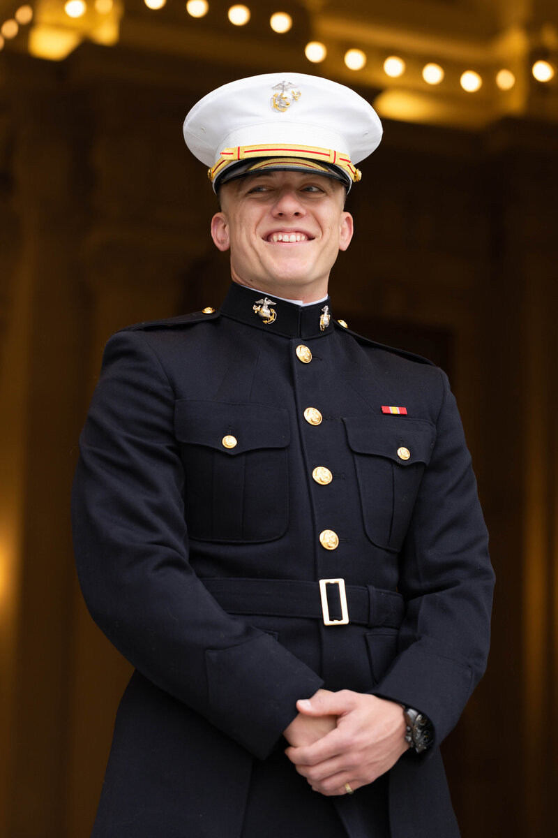 Naval Academy Marine graduate senior photo smiling in at the rotunda outside Bancroft Hall in Annapolis, Md.