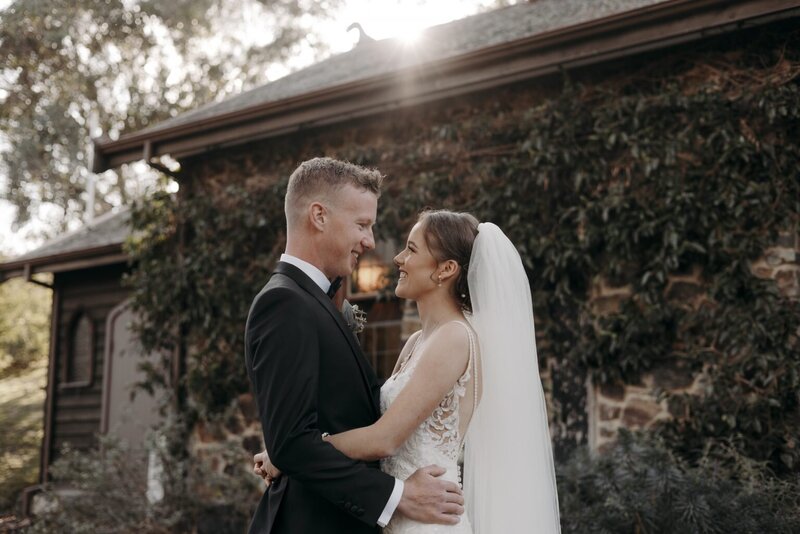 Maddy and Tyler smiling at each other