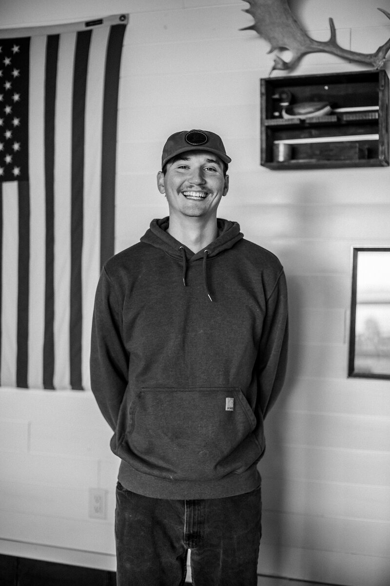A man standing in a kansas waterfowl lodge