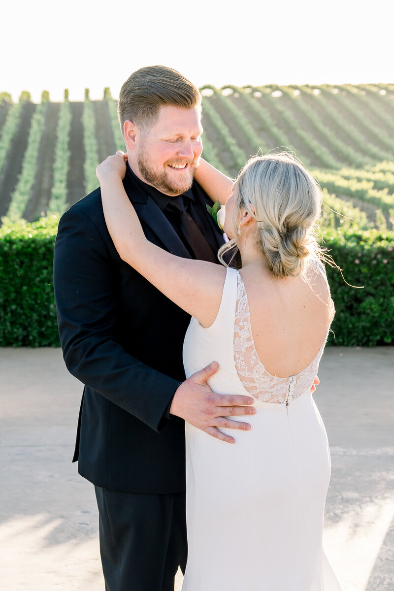 Bride + groom embrace at their Fresno elopement