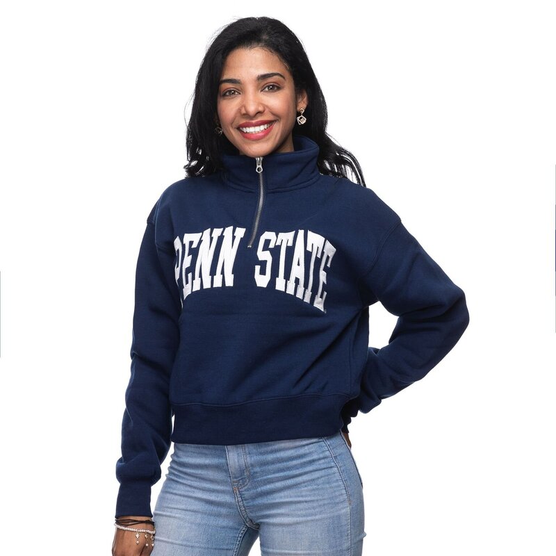 blue pullover with half zip and college name across chest
