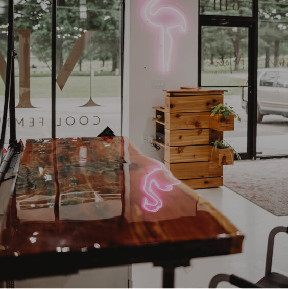 A custom-made cedar and epoxy slab tops each of the salon stations at Moxie by KC