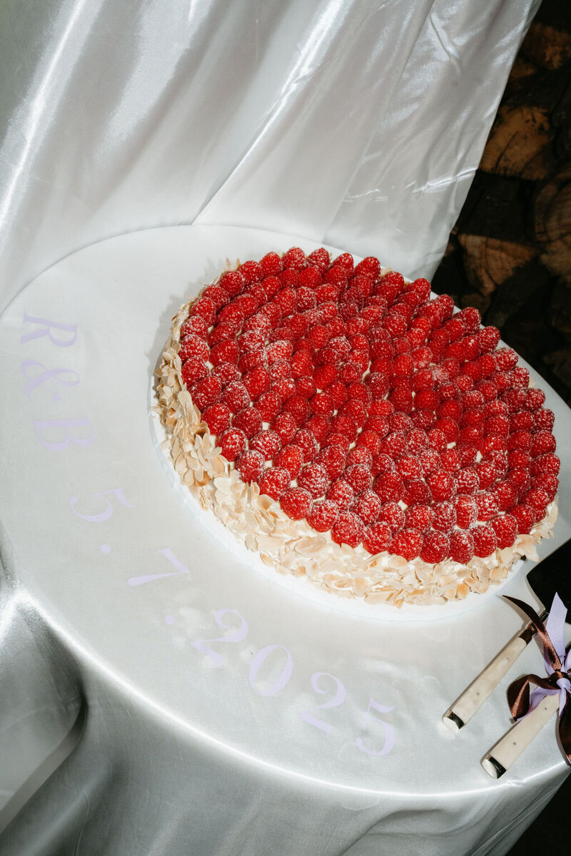 raspberry topped wedding cake, personalised table cloth