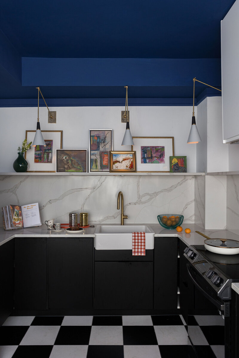 a bookshelf and lamp in a home office