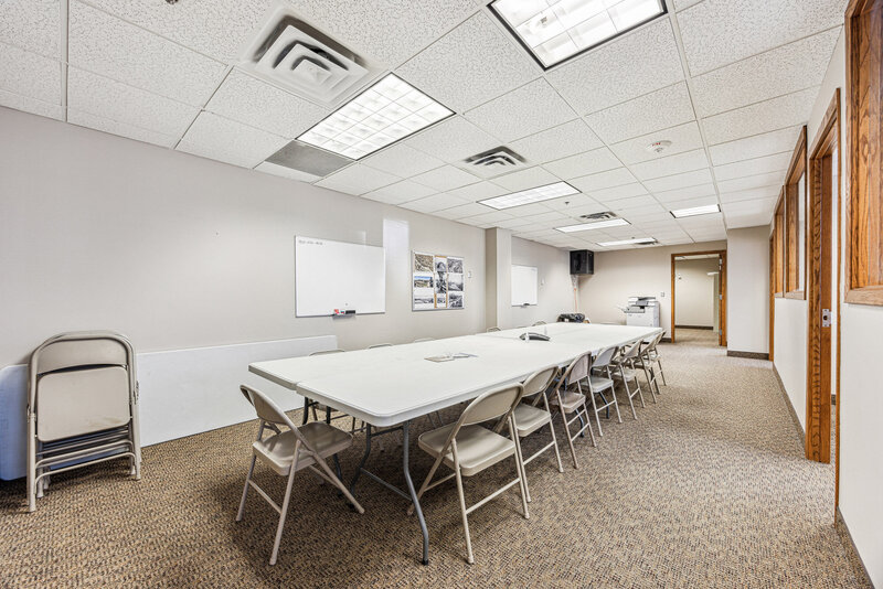 Temporary office space with folding chairs and a folding table