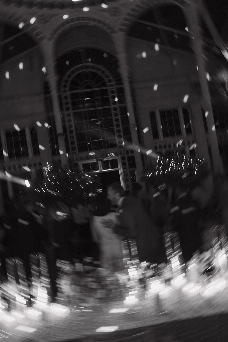 Wedding photographer captures couple taking a stroll hand in hand at their french chateau wedding.
