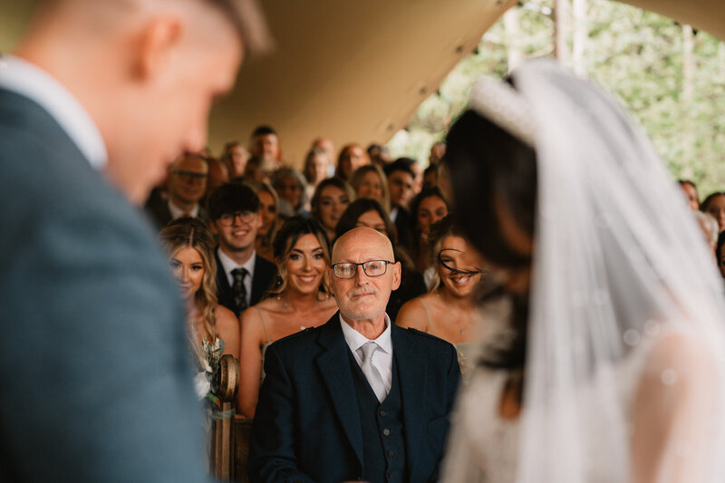 Father of the bride during wedding ceremony. 
