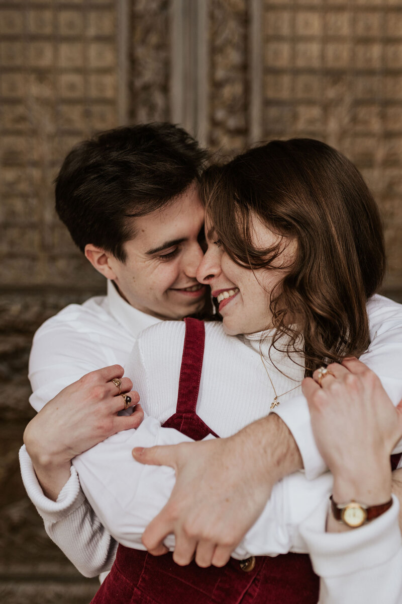 an engaged couple touching foreheads