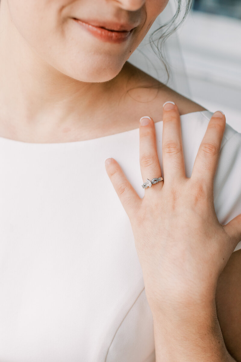 A bride wears her engagement ring.