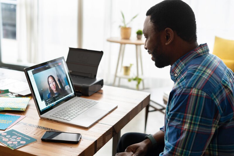 Laptop on desk during virtual therapy session for man with anxiety in south carolina