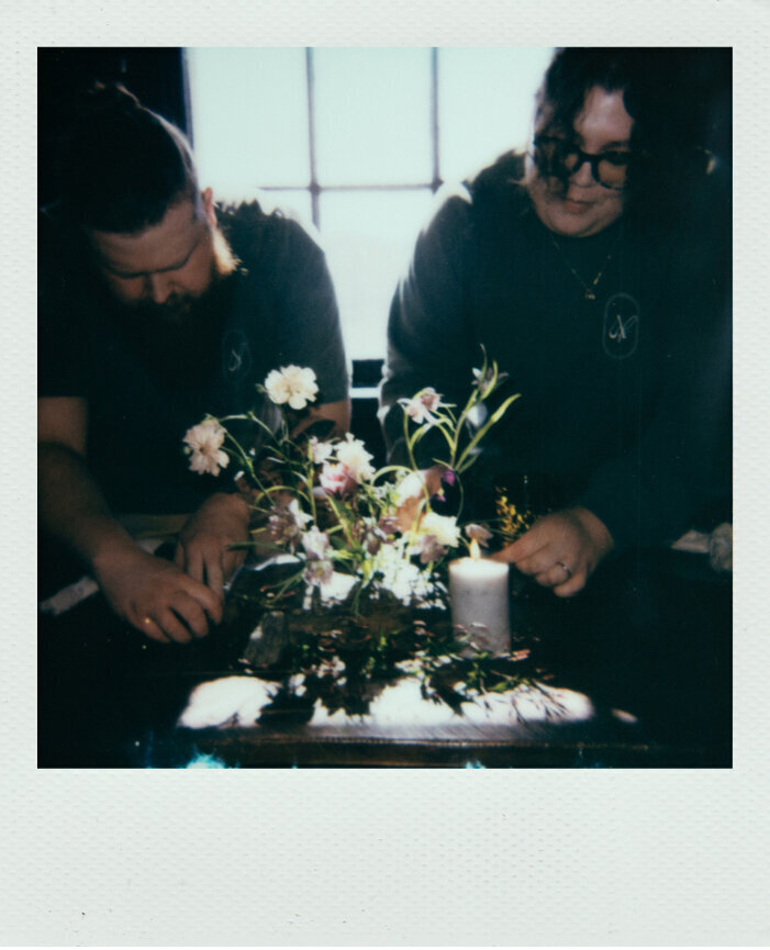 Wedding florist in Atlanta designing centerpiece.
