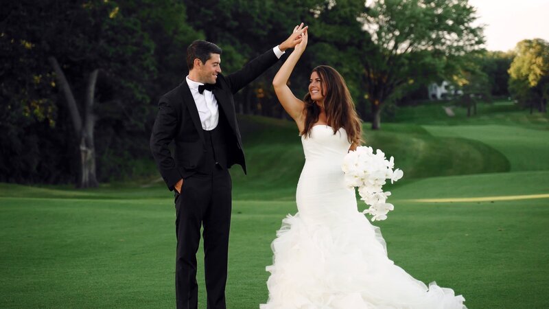 Jewish Wedding. Groom twirls bride. On Golf course. In blak tie attire.  Oak Ridge Country Club Hopkins, MN