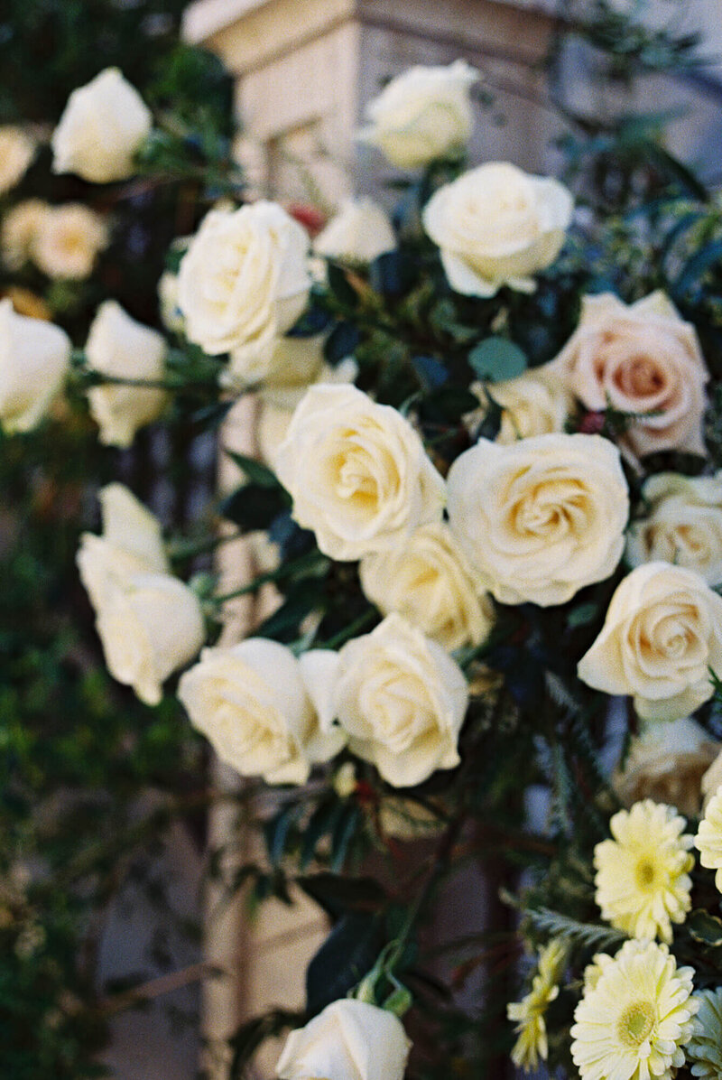 film photography of wedding flowers over a staircase
