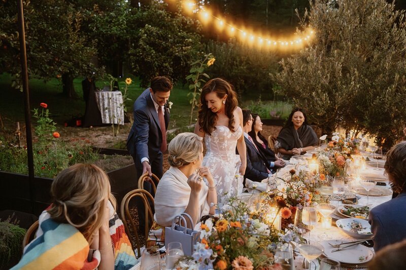 Couple tenderly holding hands during their sunrise adventure elopement portraits