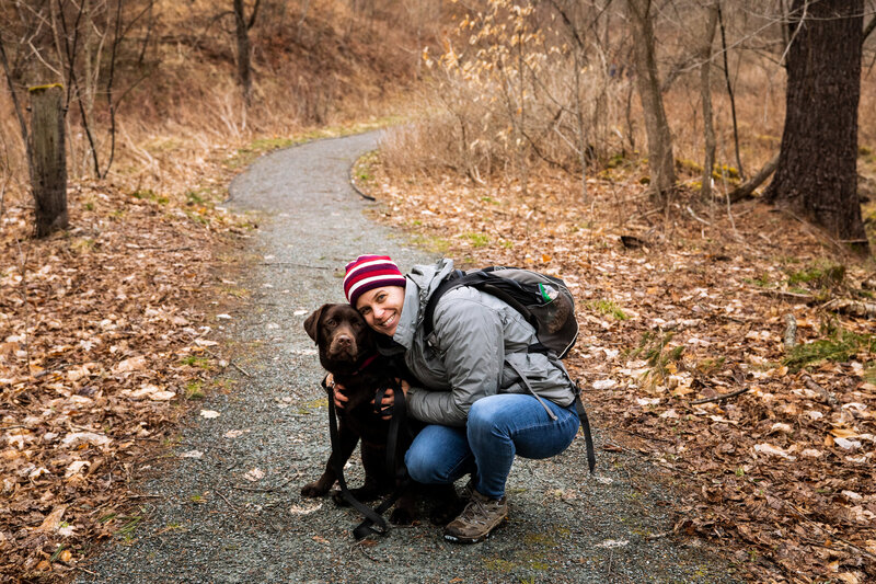 Kate Farrell, Stowe Vermont Photographer, with her dog on a walk.