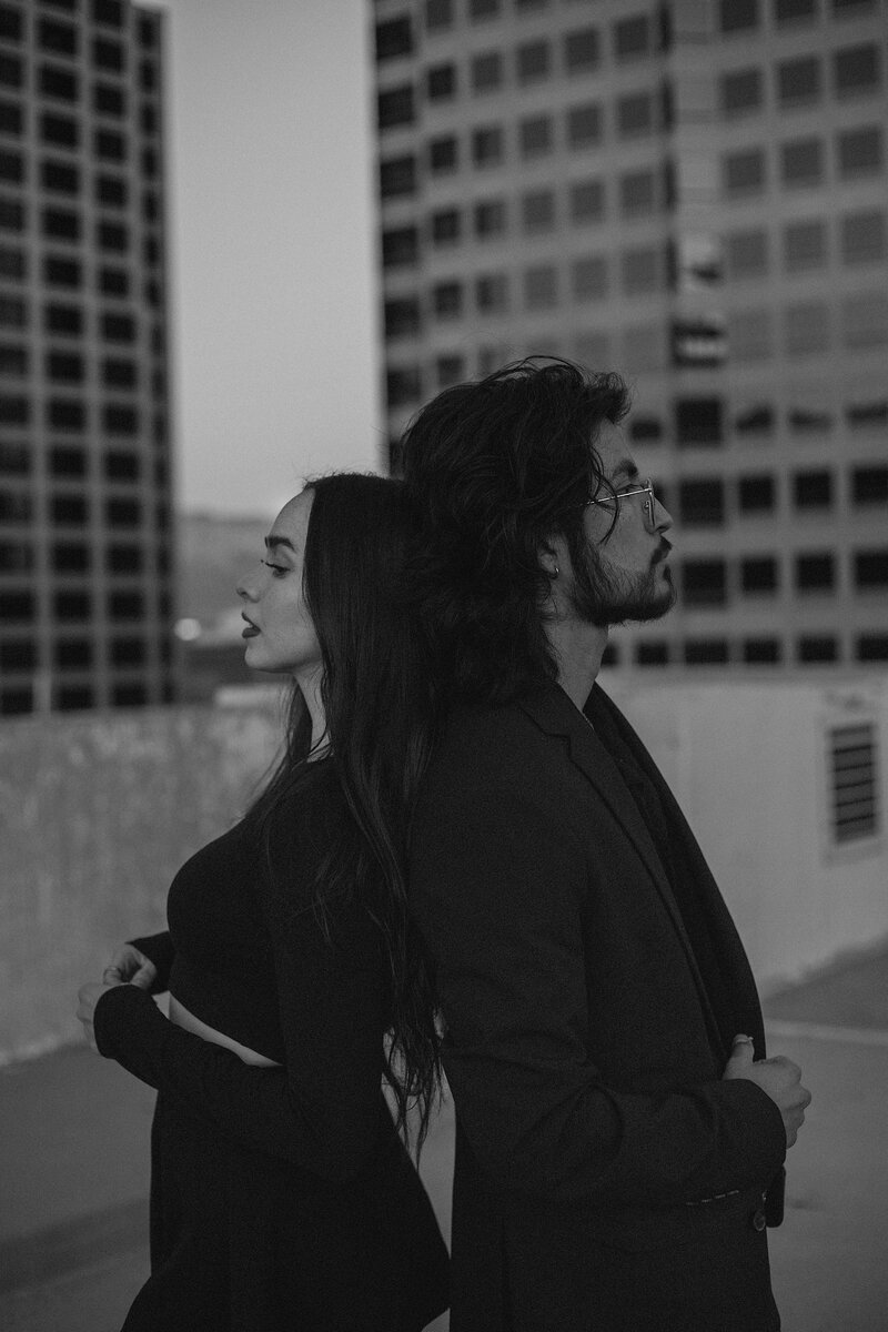 Couple posing together on rooftop in albuquerque.