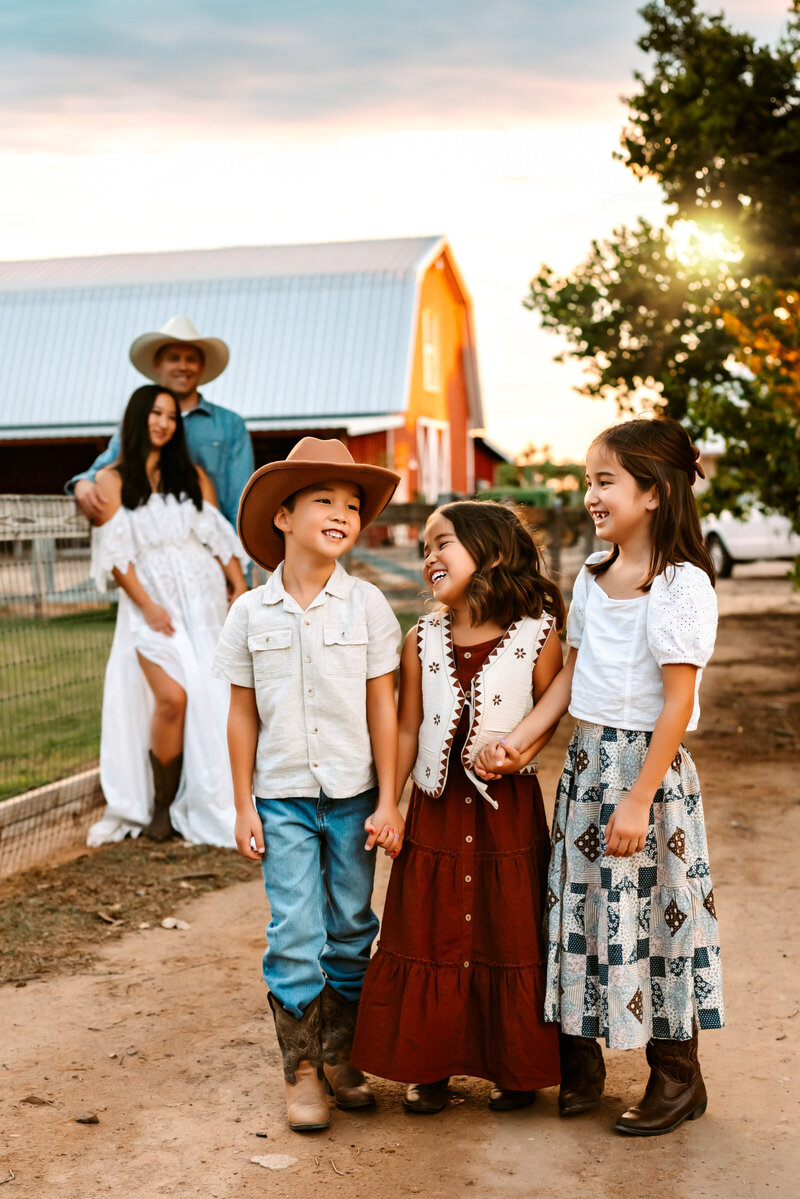 Kids holding hand on farm in Arizona