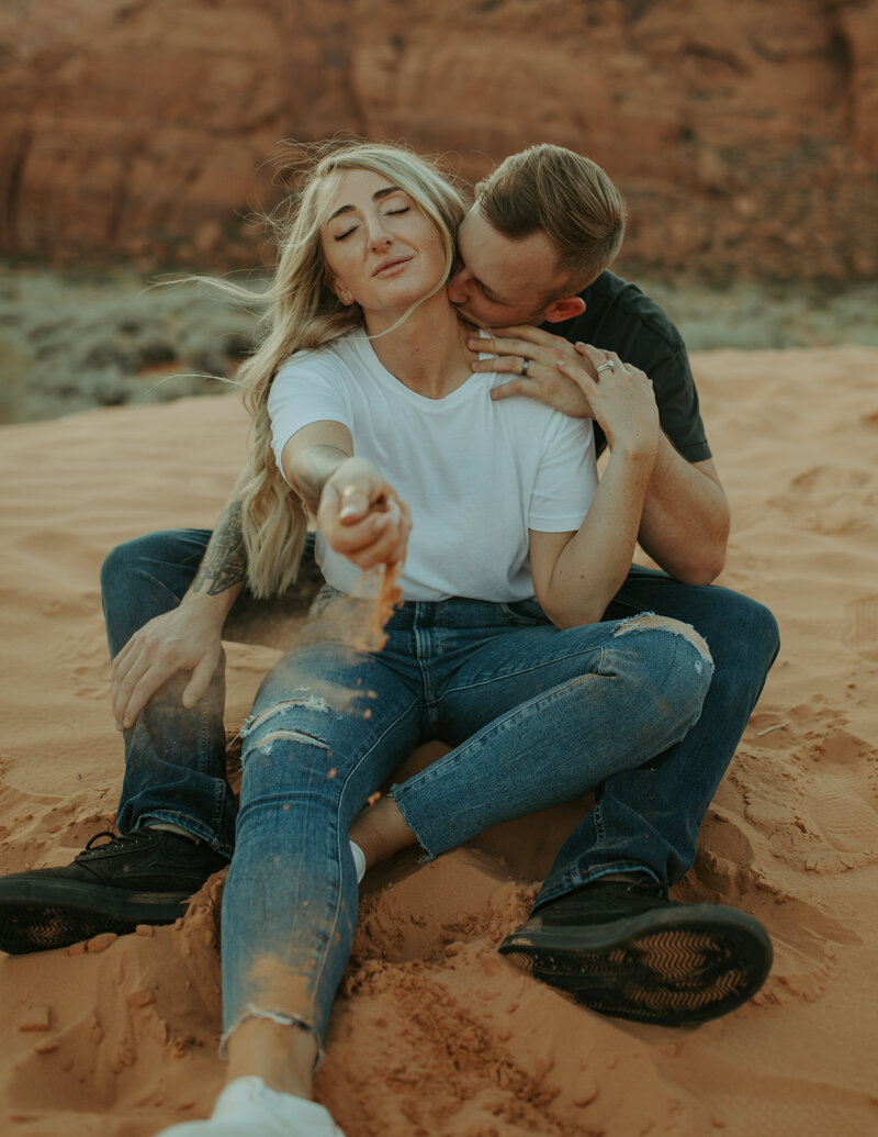 Engaged couple taking photos the night before their elopement at Snow Canyon State Park in St.George Utah