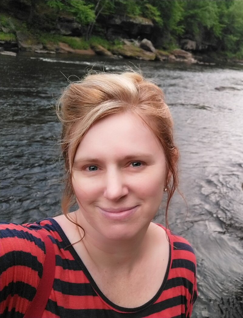 Smiling woman with river background