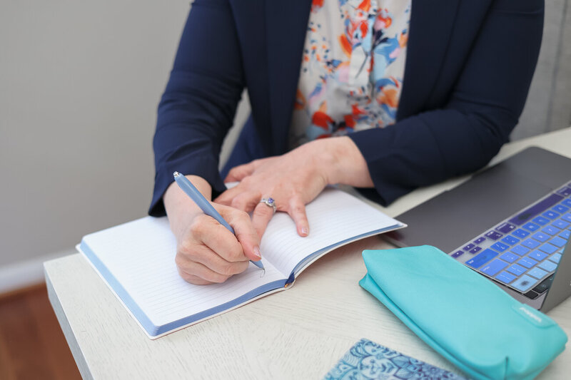 Entrepreneur confidently using a laptop to manage business workflows and systems