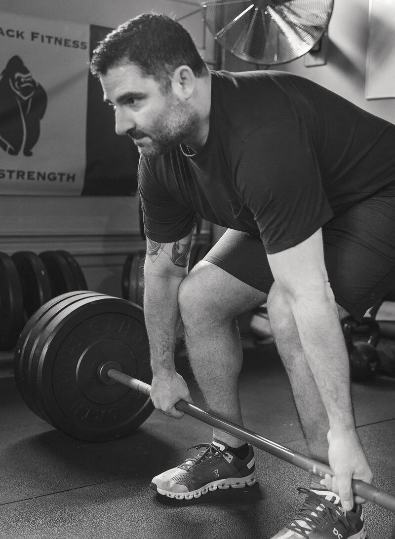Man is doing deadlifts at Silverback Fitness, Sarnia's best personal training studio.