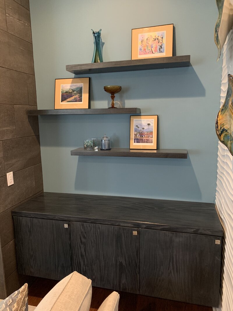 Living room custom floating shelves and cabinets