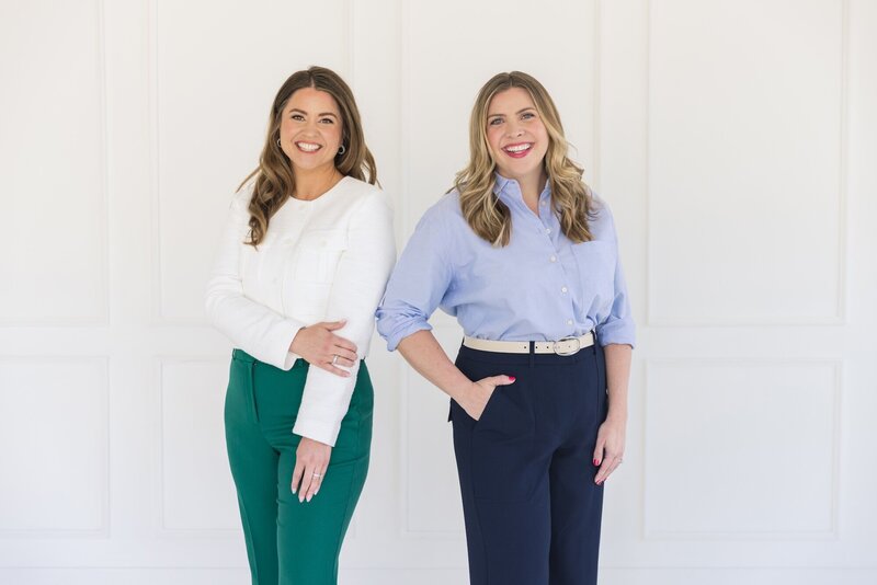 Brianna Castillo and Keelie Luttrell of Haven Realty Group, smiling together at a white desk, featured in their welcome letter on The Haven Realty Group Podcast page.
