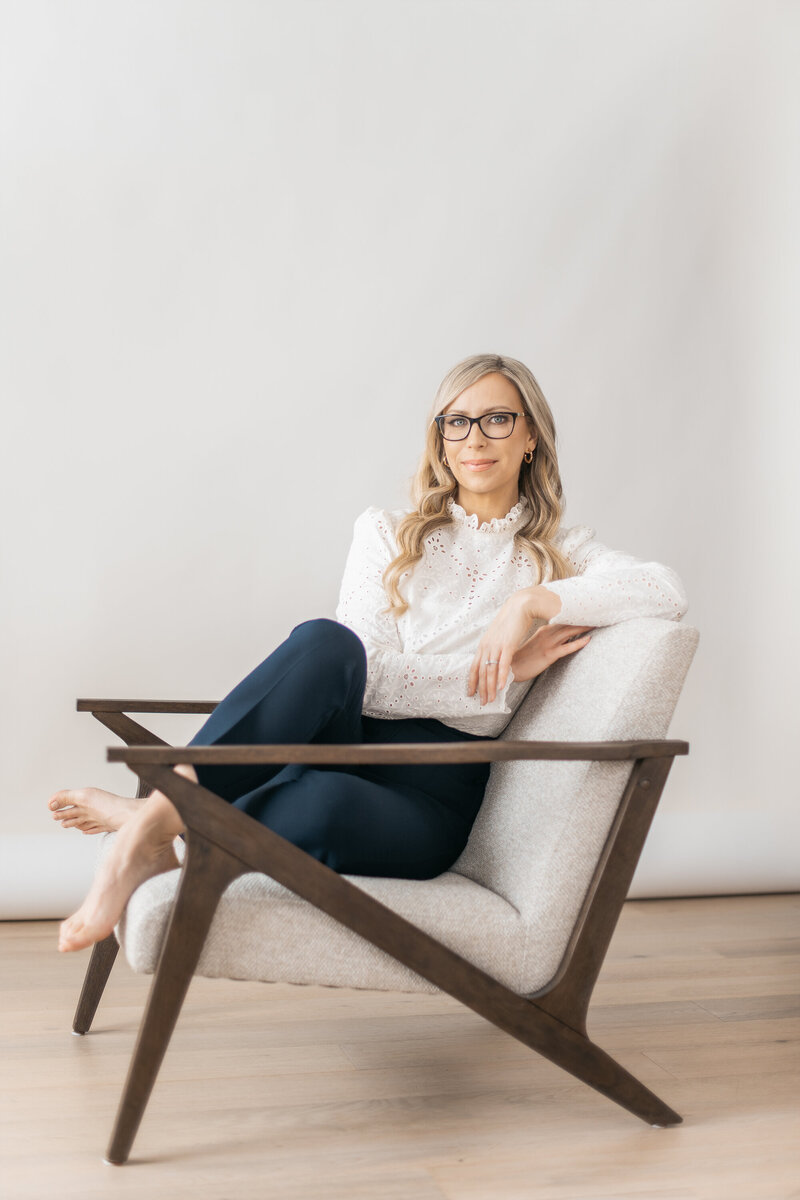 Dr. Tracy sitting in chair