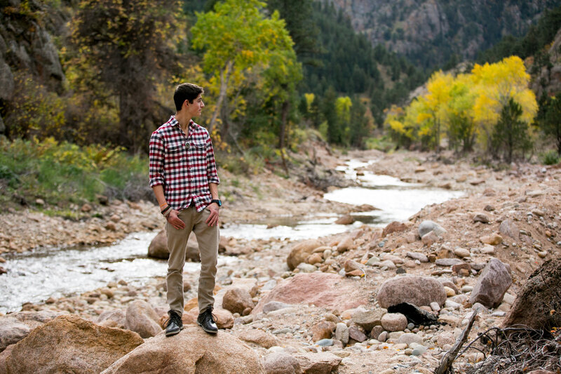 Longmont senior photos taken at a park near a river in Colorado