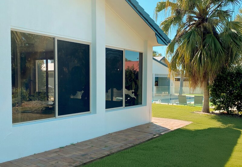 Modern home with custom double-glazed glass windows, offering energy efficiency and style for residential spaces.